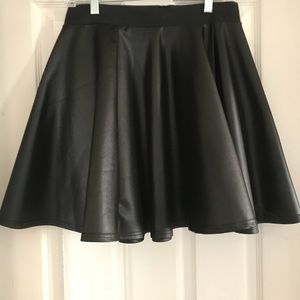 Shiny, black skater skirt! Show those legs!